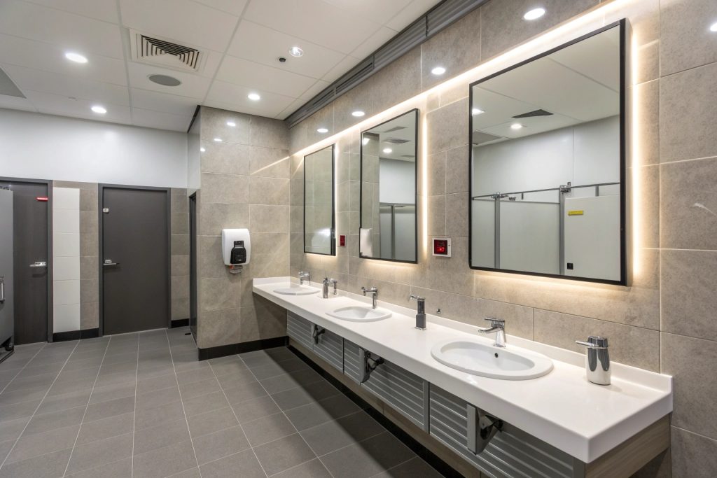 Commercial office bathroom with sensor taps and modern fixtures in Hobart workplace