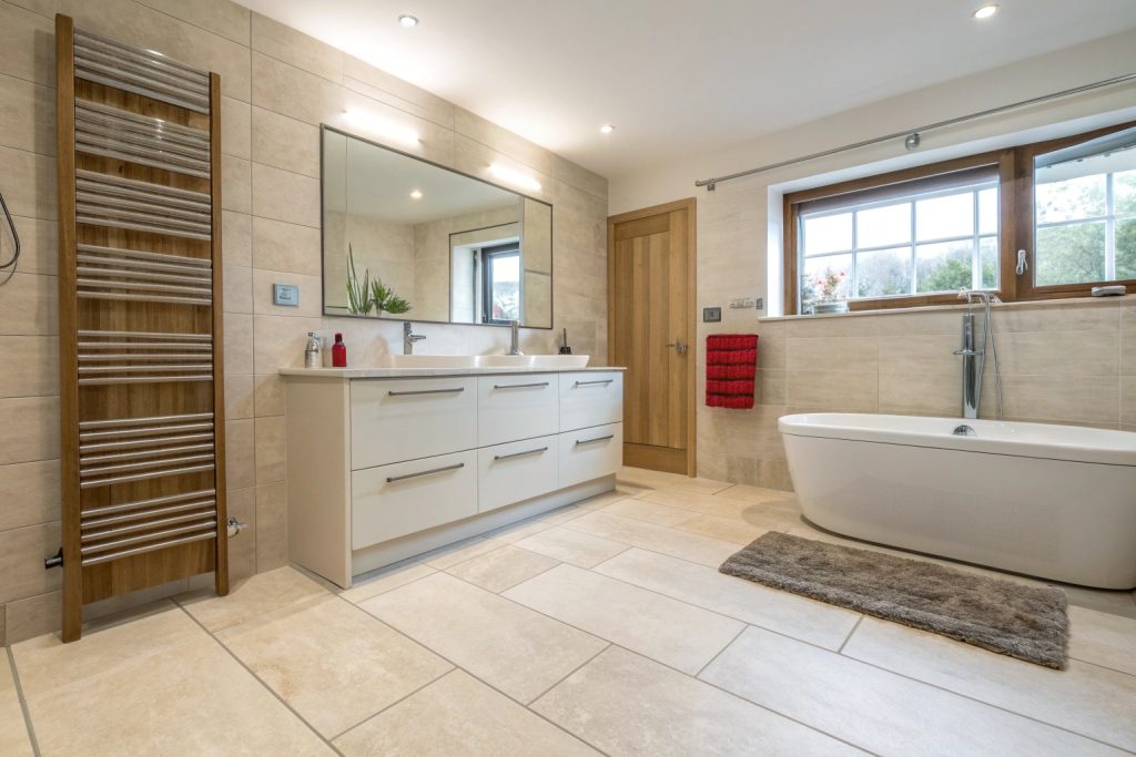 Family bathroom with heated tile flooring installation in Hobart
