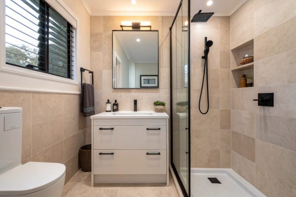 Space-efficient bathroom renovation in an established Montagu Bay home with custom vanity and storage